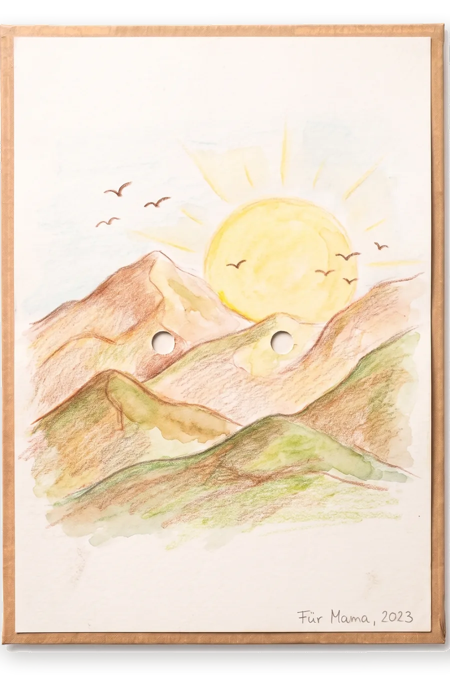 Finished board: a colourful coloured-pencil drawing of mountains, a sun and birds.
