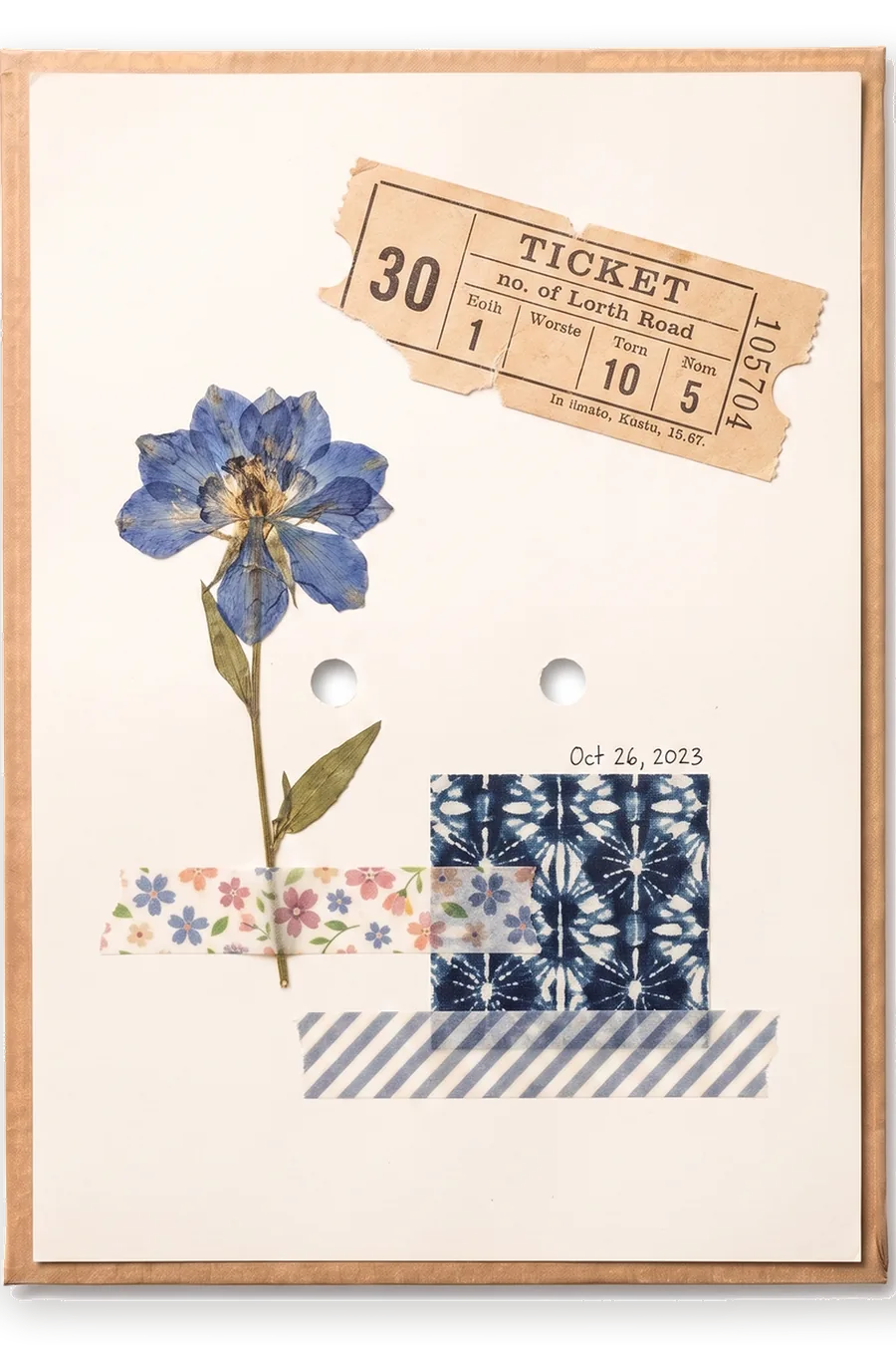 Finished board: a collage of a pressed flower, a torn ticket stub and washi tape.