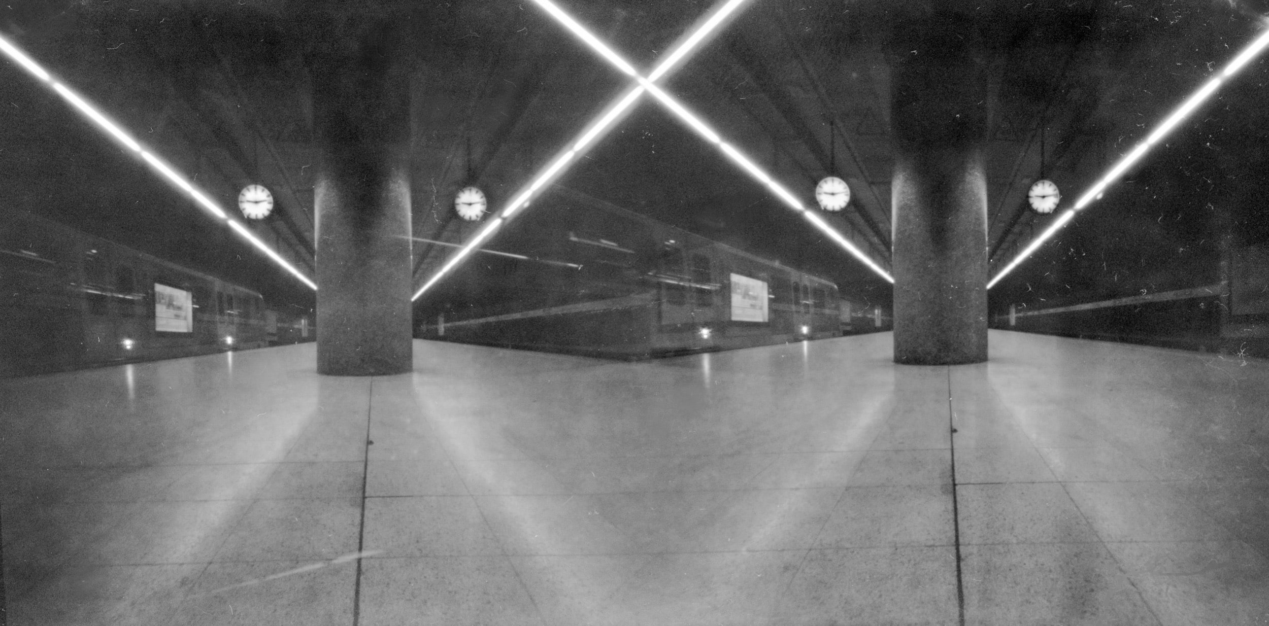 Pinhole photograph: a hall with pillars and overhead light