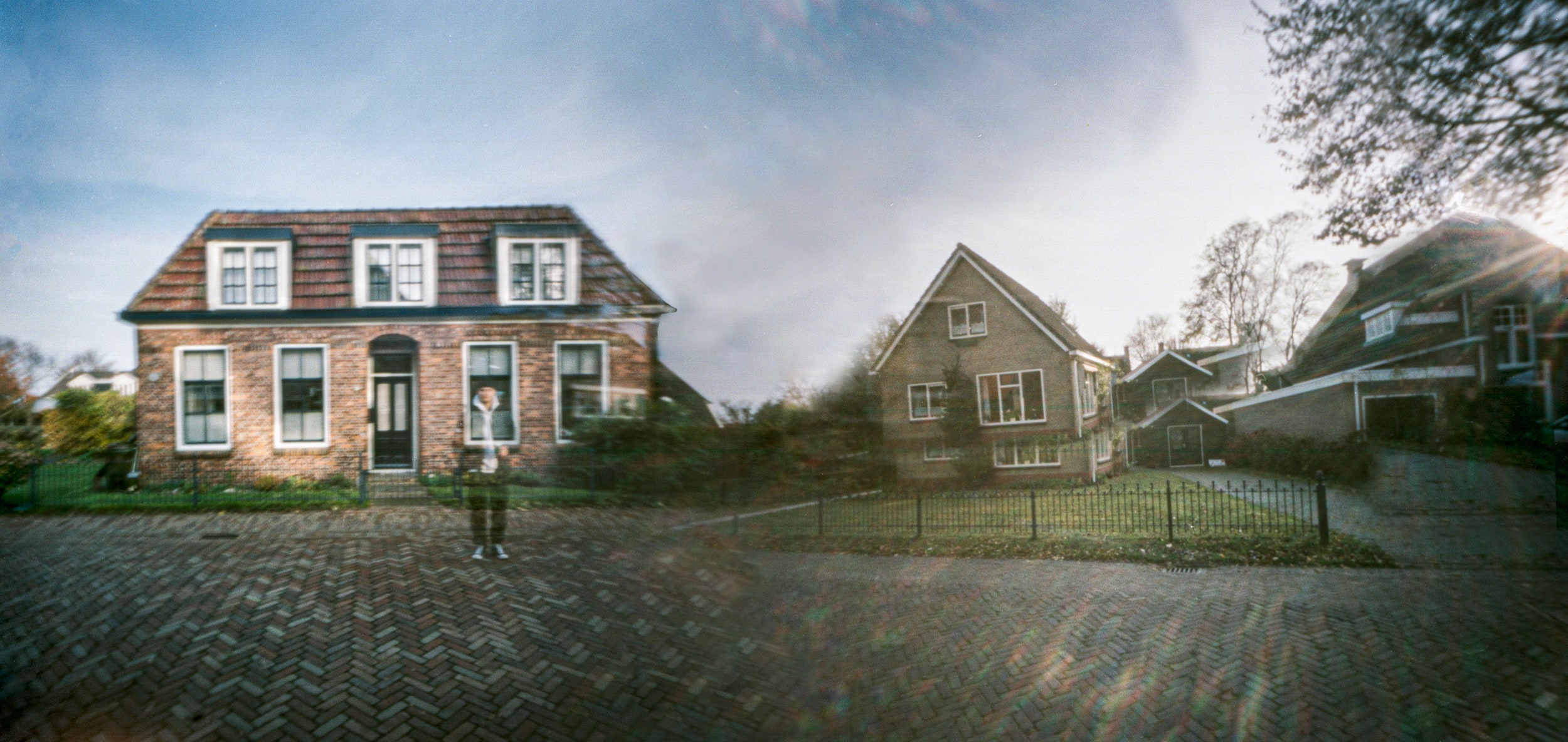 Pinhole photograph: a house behind a wide lawn