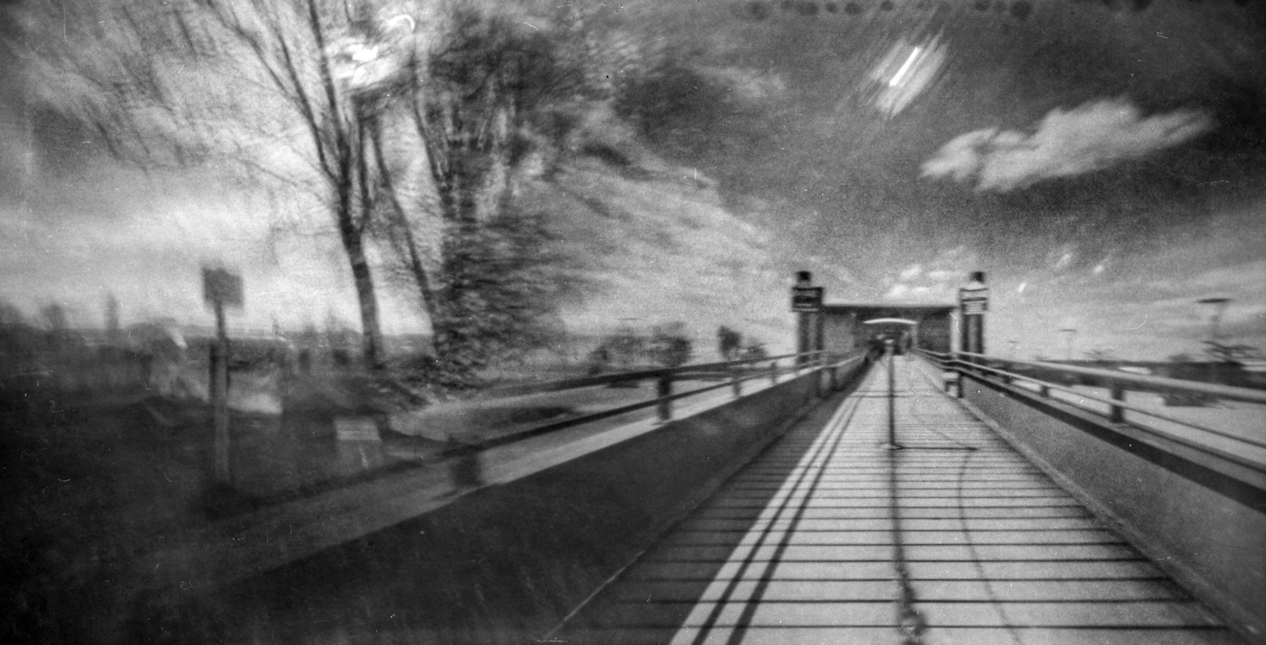 Pinhole photograph: a pier leading out into the water
