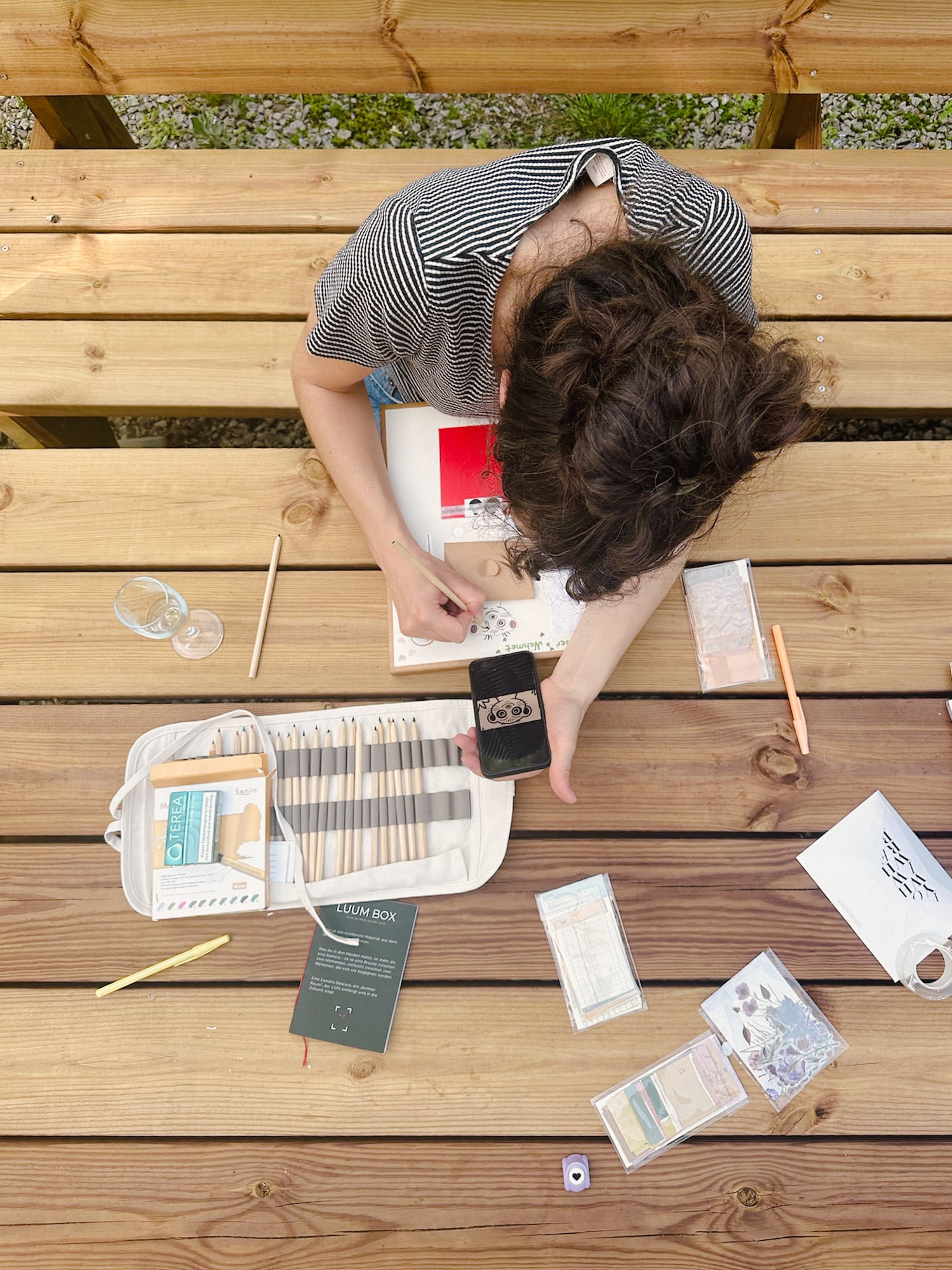 From above: a person assembling a camera